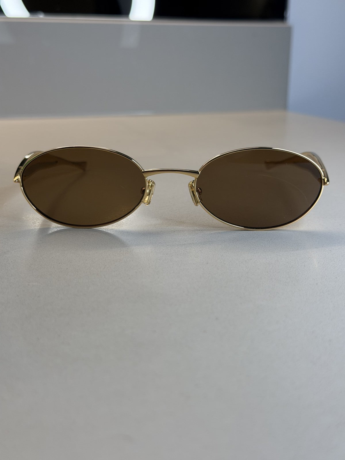 Bottega Veneta Oval Sunglasses – Gold / Brown Lens