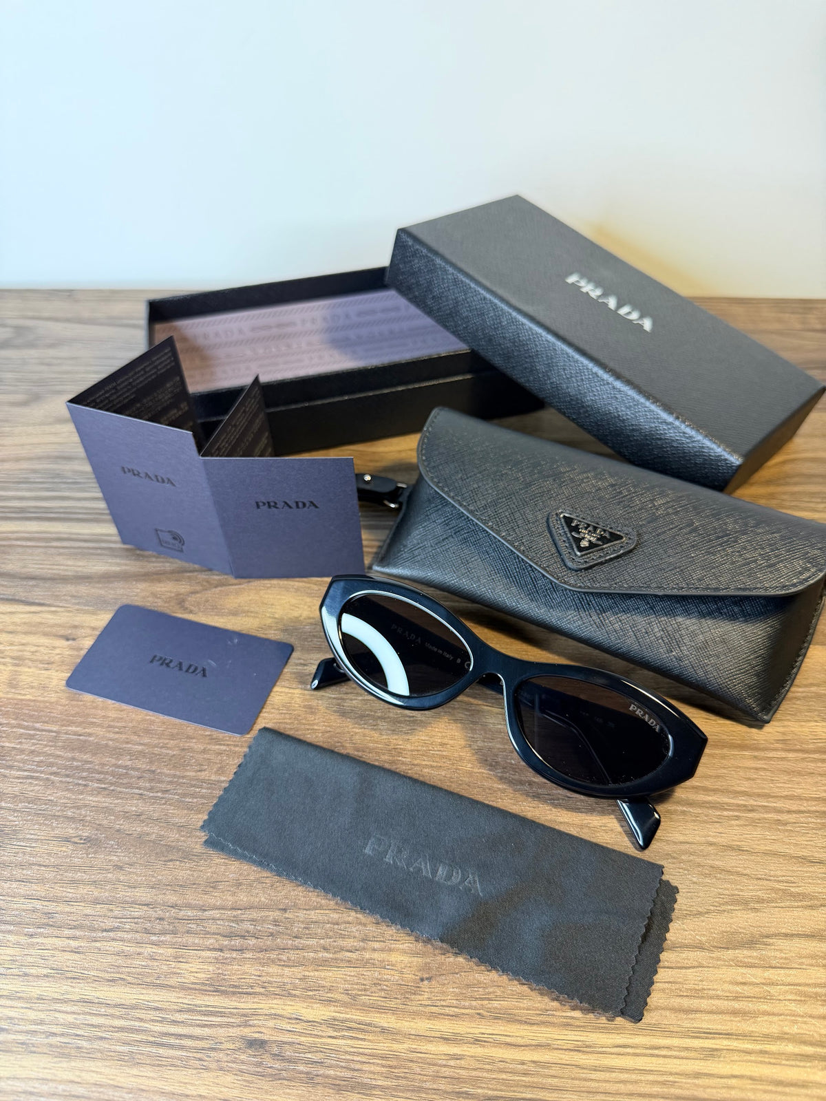 Prada SPR 26Z Cat-Eye Sunglasses – Black / Grey Lenses