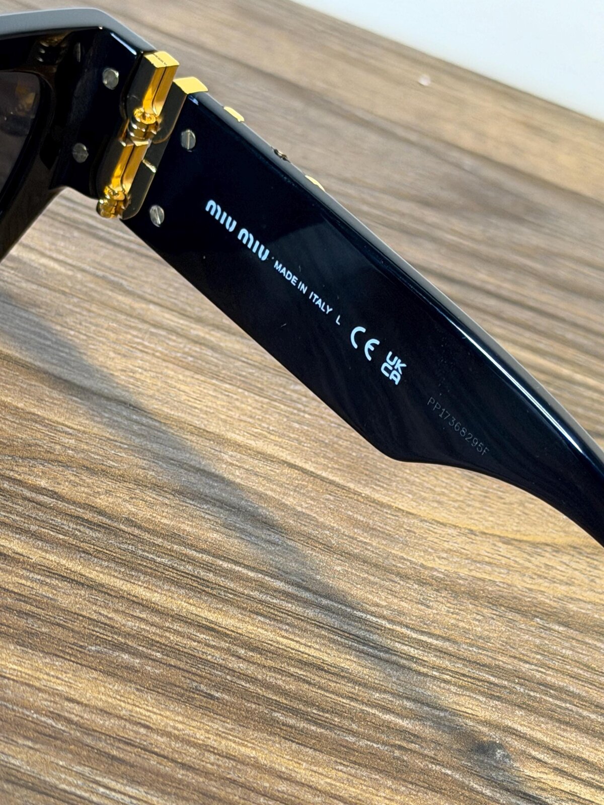 Miu Miu SMU 09W Sunglasses – Black / Gold